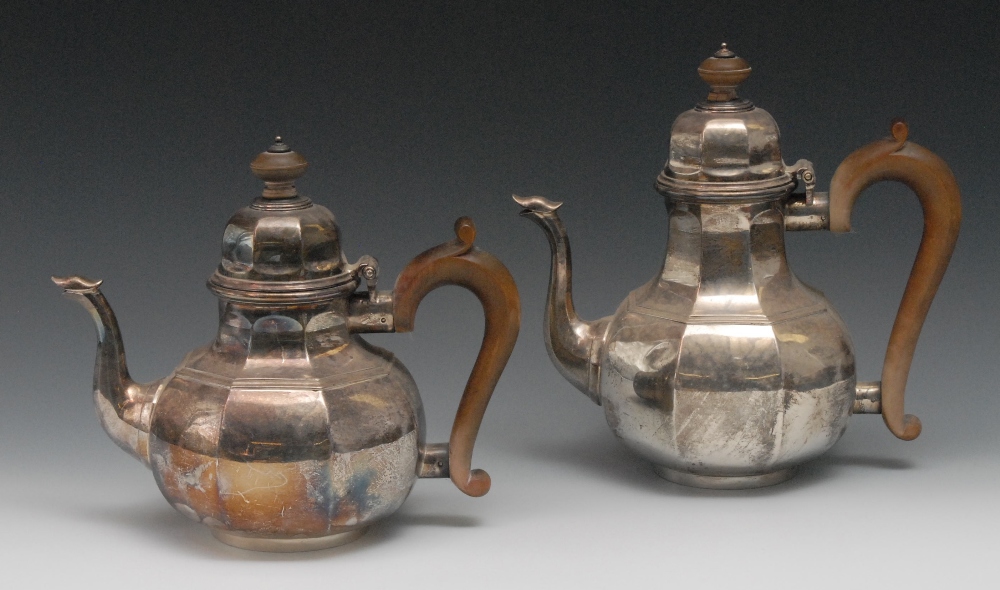 A Britannia silver octagonal teapot and coffee pot, beach ball finials and scroll handles,