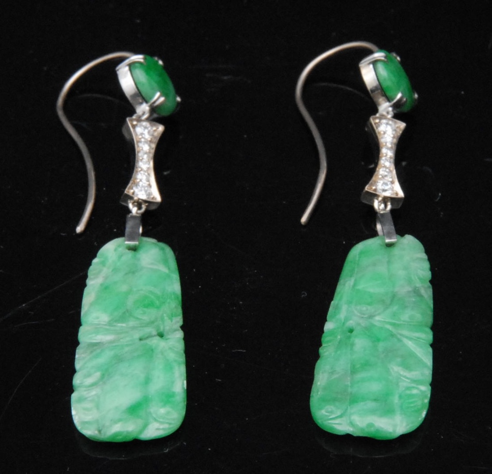 A pair of Chinese jade pendant earrings, the drops set with diamond chips, 6.5cm long