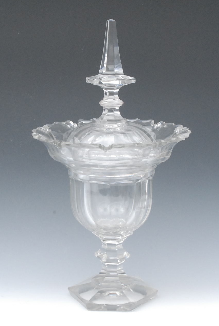 A Victorian cut glass pedestal sweetmeat urn and cover, spire finial, shaped border, spreading