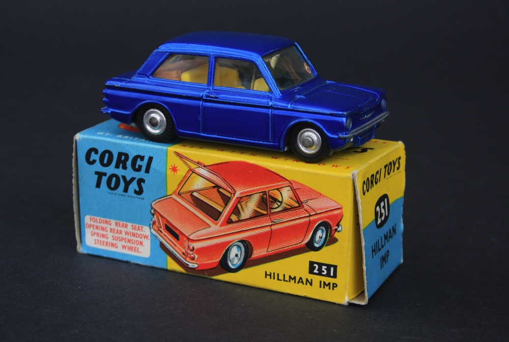 Corgi Toys 251 Hillman Imp car, metallic blue body, yellow interior, brown plastic suitcase to