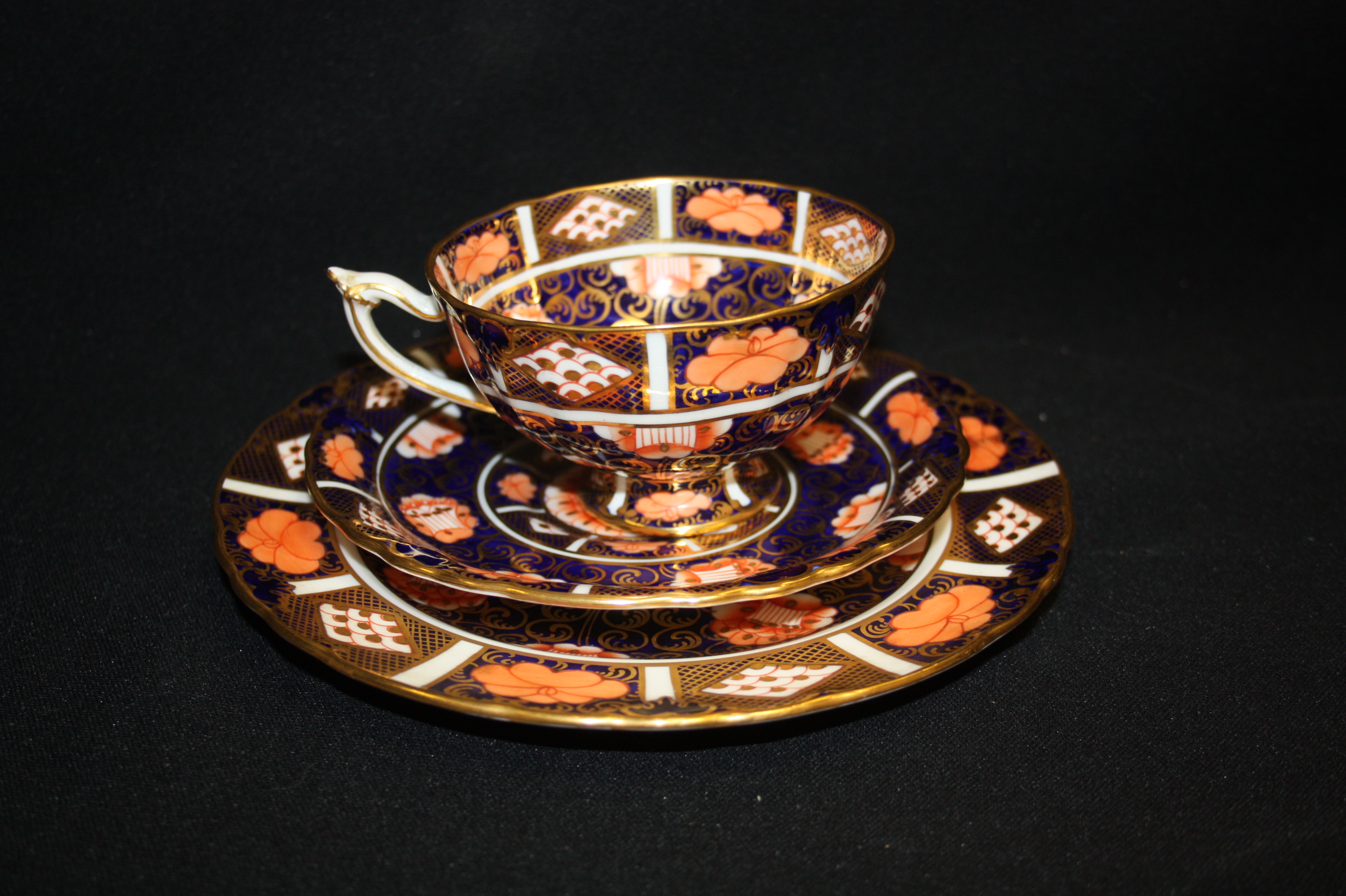 A Royal Crown Derby 9298 pattern Imari cup, saucer and side plate