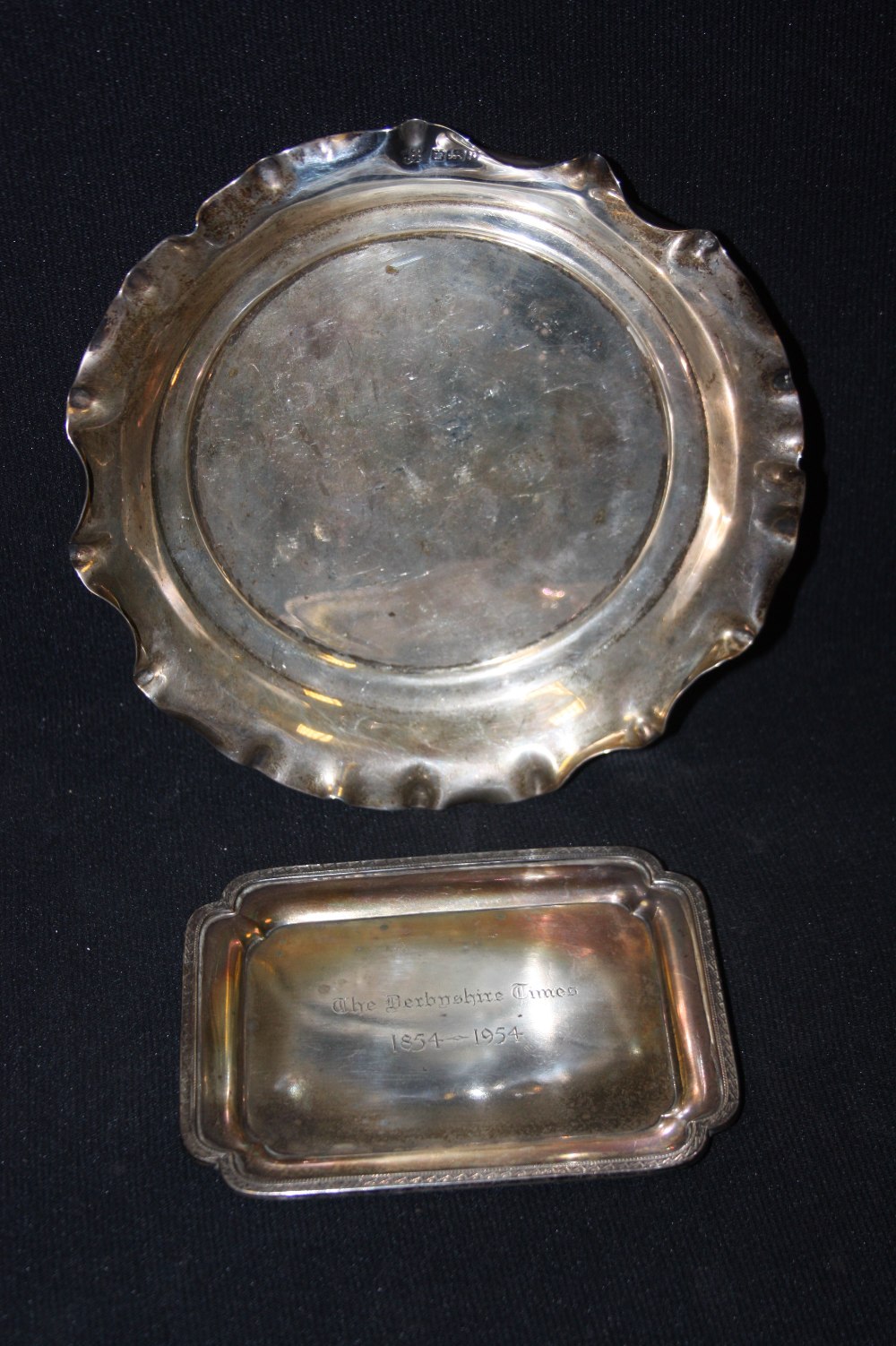 A silver shaped rectangular dish, Mappin and Webb, Sheffield 1953; a shaped circular dish (2)