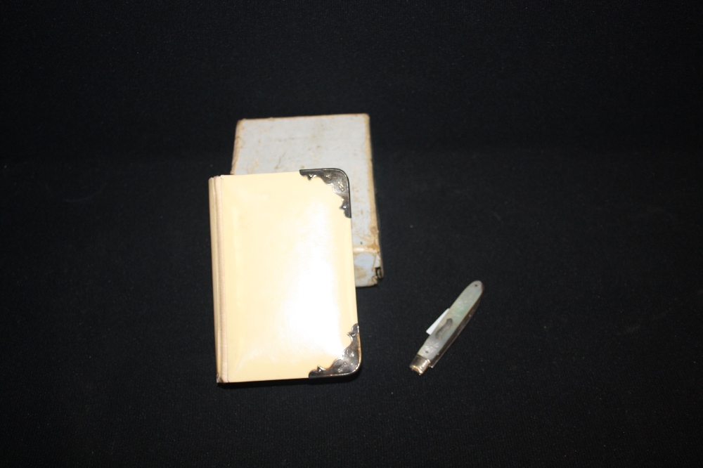 A silver mounted ivory bible; A lady`s dilver and mother of pearl fruit knife