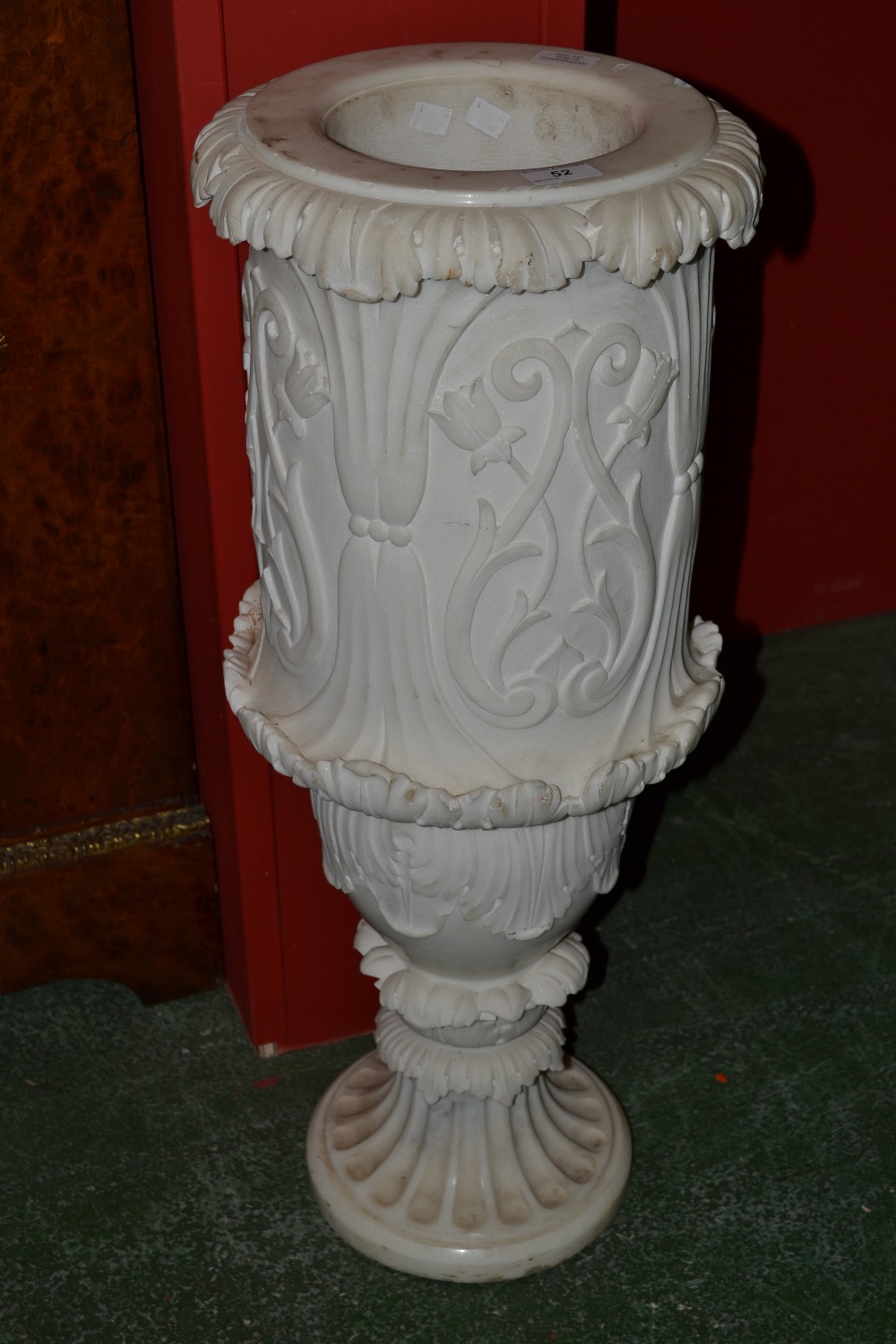 A white marble conservatory jardiniere, carved with stylised tulips and foliate scrolls, fluted