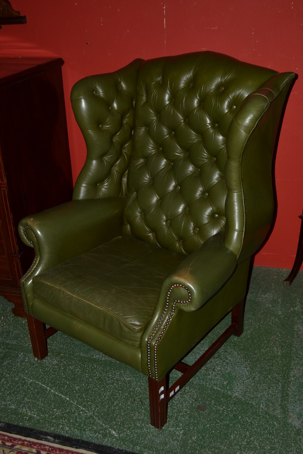 A Chesterfield wingback fireside chair