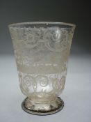 An 18th century stag hunt engraved glass beaker with metal mounted toast rim, 9cm tall.