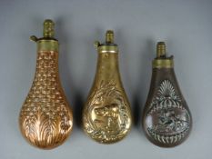 A copper and brass powder flask by James Dixon & Sons , Sheffield, and two coper and brass powder