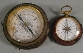 A late Georgian pocket compass by Abraham & Co, contained in a gilt brass case, 3cm. diameter,