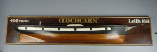 A half block model of the Locharn of Leith, the hull painted black to waterline with gilt scroll