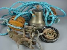 A small ship`s bell, two wooden blocks and a collection of rowlocks, etc.