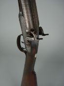 A Westly Richards percussion cap 12bore side by side shot gun, serial number 2043, the damascus