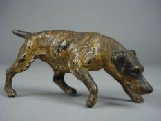 An Austrian cold painted figure of a hound, 10cm long.