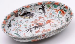 A Chinese famille verte deep dish of oval fluted form, the interior decorated with crabs, lobsters