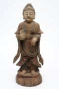 A Chinese carved and painted gessoed wood figure of Buddha, his right hand in abhaya mudra,