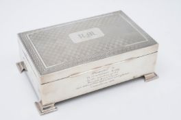 A George V silver cigarette/cigar casket, maker J.C.Ltd, Birmingham, 1925, of rectangular shape, the
