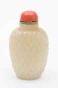 A Chinese jade snuff bottle of ovoid form, carved overall with a wickerwork pattern, 18th/19th