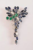 A sapphire, emerald and diamond cluster brooch: designed as an informal cluster of marquise-cut