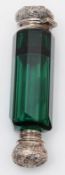 A Victorian silver and green glass double ended scent bottle, unmarked. of faceted form, 10.5cm.