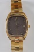 Omega. A gentleman’s 18ct gold ‘Omega De Ville Quartz’ wristwatch, the rectangular dial with baton