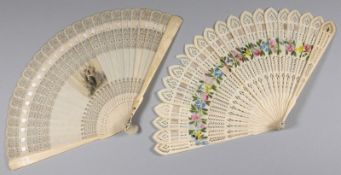 A Regency period ivory brise fan, the sticks with pierced and painted floral decoration, 16cm. long,