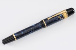 Montblanc. A black and blue marble effect fountain pen inscribed ‘Edgar A Poe’, numbered ‘15208/