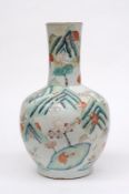 A Chinese porcelain bottle vase enamelled with numerous monkeys in a mountainous landscape variously