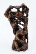 A Chinese carved rootwood figure group of a group of young monkeys and mother climbing a gourd