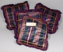 Four 19th century Japanese silk cushions in purple, blue and orange stripes, each with a later