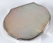 A 19th century mother-of-pearl set snuff box, of cartouche shaped outline decorated with figures