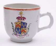 A Chinese famille rose armorial coffee cup of large size, painted on both sides in bright colours