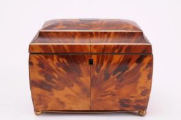 An early 19th century blonde tortoiseshell and ivory strung tea caddy of rectangular outline, the