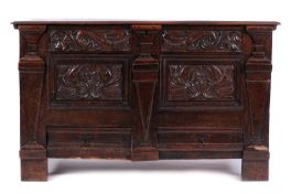 A 17th Century oak rectangular coffer, the plain hinged moulded top enclosing an interior adapted