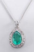 An emerald and diamond mounted pear-shaped pendant with central pear-shaped emerald approximately