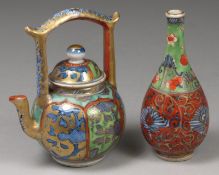 A small Chinese porcelain wine pot and a vase the former with domed cover and overhead handle with