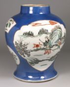A Chinese famille verte baluster vase painted with shaped figure and floral panels including a