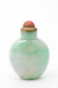 A Chinese jadeite snuff bottle of ovoid form, the stone of mottled celadon and bright apple green