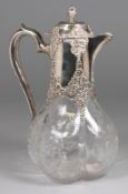 A Victorian silver mounted ‘rock’ crystal claret jug, maker W.C, London, 1899, of lobed quatrefoil
