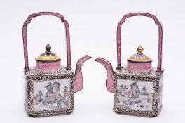 A pair of Canton enamel famille rose wine ewers of shaped square outline with arched handles and