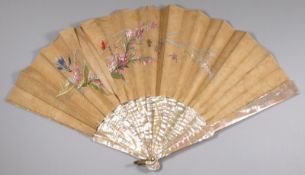 A 19th century French fan, the silk leaf with painted floral spray with dragonfly and butterflies,