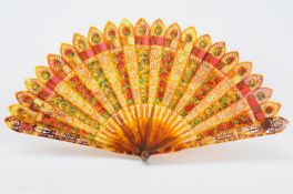 A 19th century small tortoiseshell brise fan, the leaves with alternated painted floral or pierced
