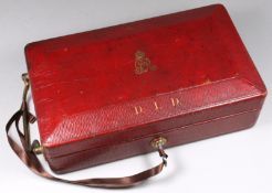 A George V red morocco leather dispatch box, the hinged lid with gilt Royal Cypher and initialled