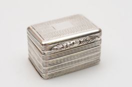 A George IV silver nutmeg grater , of rectangular outline, the hinged lid and base with engine