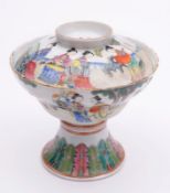 A Chinese porcelain pedestal bowl and cover the ogee shaped bowl and domed cover enamelled in the
