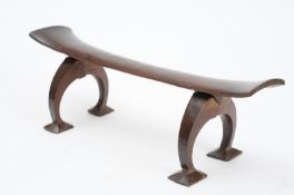 A late 19th/early 20th century Tongan Headrest the slender curved rest with flared ends having two