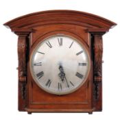 A late 19th Century circular wall clock, of large size in carved walnut overmantel surround,