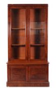 By Maple & Co, London-A Victorian mahogany bookcase, the upper part fitted with adjustable shelves