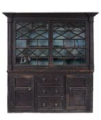 An unusual 19th Century stained pine kitchen dresser, the upper part with a moulded cornice of