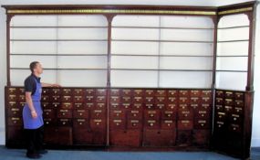 John Curtis & Son, Leeds-A set of Victorian mahogany pharmacy cabinets, comprising a long run in two