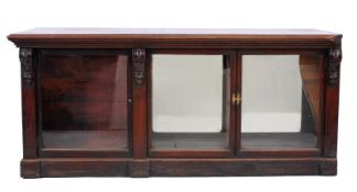 A Victorian pine and stained mahogany draper’s counter, the front with three glazed panel doors