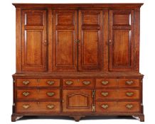 An 18th Century oak and mahogany crossbanded housekeeper’s cupboard, the upper part with a moulded